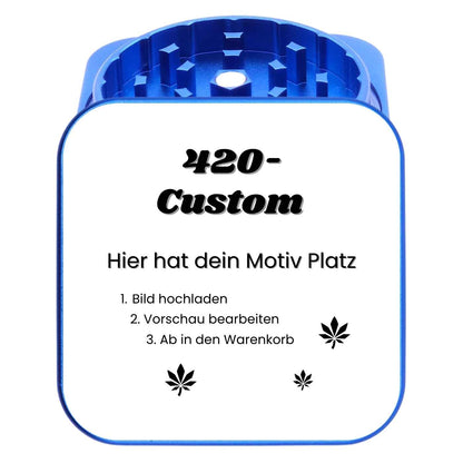 Blauer quadratischer Grinder mit hochwertigem Fotodruck – selbst gestaltbares Kiffergeschenk.